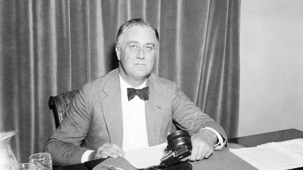 Franklin D. Roosevelt gives a national address, one of his "fireside chats", on the merits of his "recovery" program, at the White House in Washington, DC, on June 28, 1934. (Harris & Ewing/Public Domain)