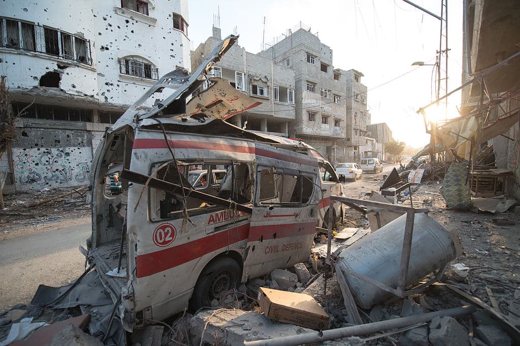 A photo of destruction in Shuja'iyya, including a destroyed ambulance, taken during the 72-hour ceasefire between Hamas and Israel on August 6, 2014, during Israel's full-scale military assault on Gaza dubbed "Operation Protective Edge". (Boris Niehaus/Wikimedia Commons)