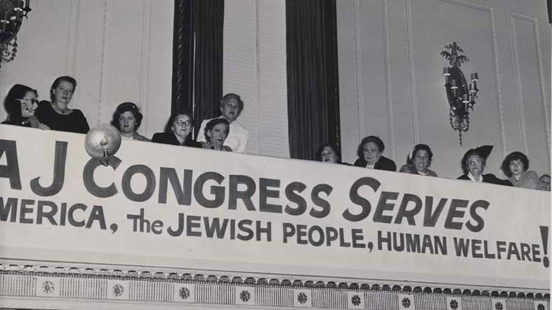 A banner at the 1953 American Jewish Congress National Convention, Women's Division, reads "AJCongress Serves America, the Jewish People, Human Welfare!" (Center for Jewish History)